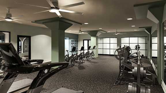 A gym with a variety of equipment including weights and bikes at The Carousel, Richmond, 23220