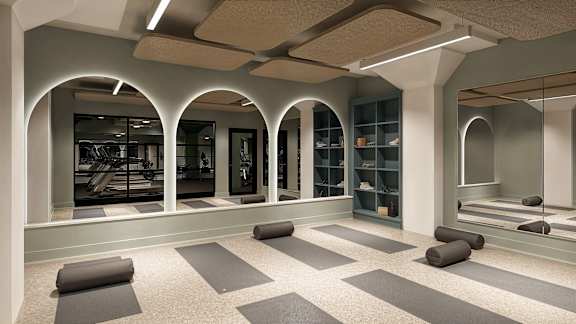 A yoga studio with grey mats on the floor at The Carousel, Richmond, VA