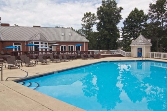 the swimming pool at the resort with chairs around it at The Timbers, Richmond, 23235