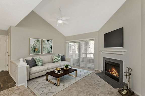 a living room with a fireplace and a couch at Beacon Ridge Apartments, PRG Real Estate Management, Greenville, SC 29615