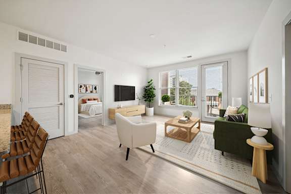 A modern living room with a white sofa and a wooden coffee table at Circ Apartments, Virginia