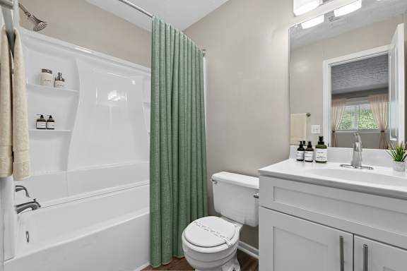 Bathroom with updated vanity, tub shower combination and modern fixtures