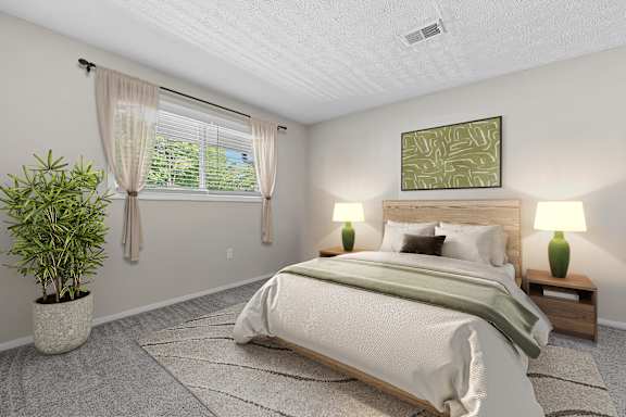 Bedroom with large windows, plush carpeting and abundant natural light