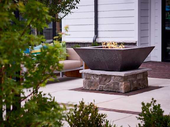 Outdoor fire pit area with chairs at Berewick Pointe Apartments in Charlotte, NC