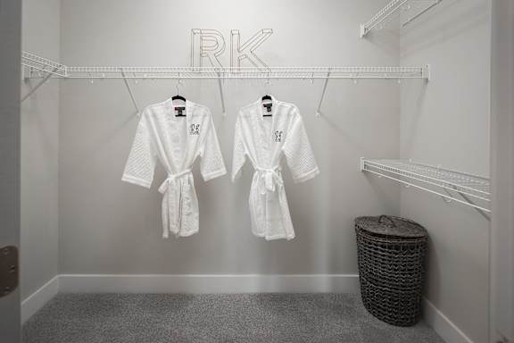 Walk-in closet with wire shelving and dual robes at Pointe at Research Park Apartments, North Carolina, 28262