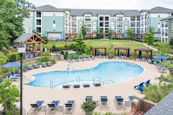 Resort style pool with spa and covered cabanas at TRAILSIDE VERDAE Apartments, South Carolina