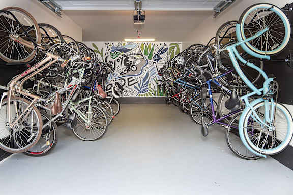 Bike storage garage with wall mounted racks at TRAILSIDE VERDAE Apartments, GREENVILLE, SC 29607