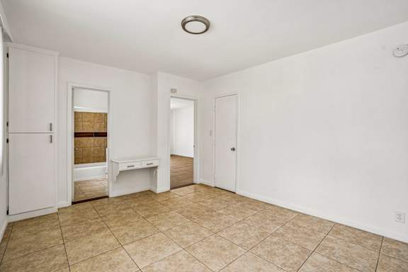 A room with white walls and a tiled floor.