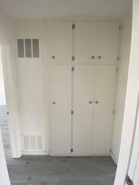 A white door with a vent above it.