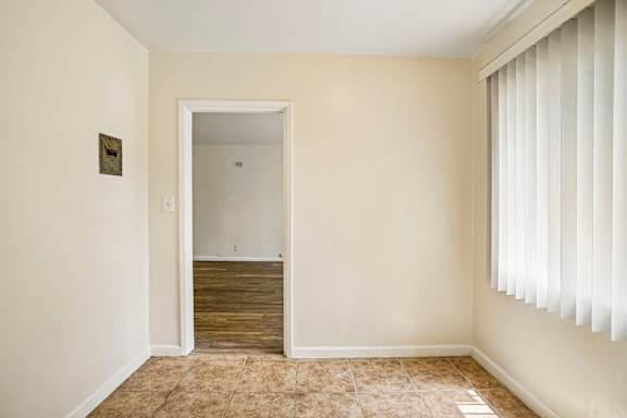A room with a doorway leading to another room.