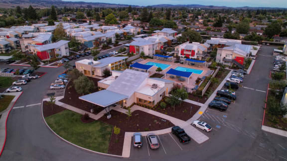 an aerial view of a building with a large solar panel on the roof at Addison Ranch Apartments, Petaluma, CA