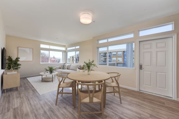 a living room with a dining room table and a couch  at Addison Ranch Apartments, Petaluma, CA