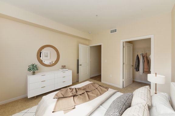 a bedroom with a bed and dresser and a closet  at Addison Ranch Apartments, Petaluma, CA