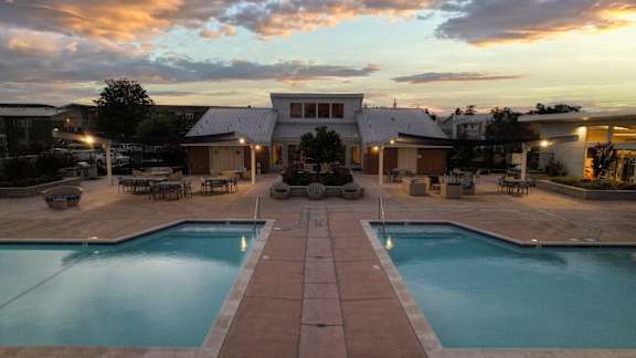 A large house with a pool in the backyard.