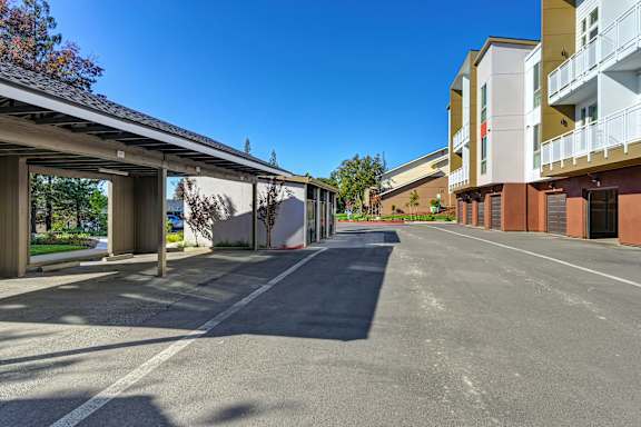A street view of a residential area with apartment buildings on both sides.