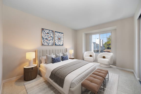 a master bedroom with a large bed and a window