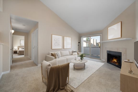 a living room with a white couch and a fireplace