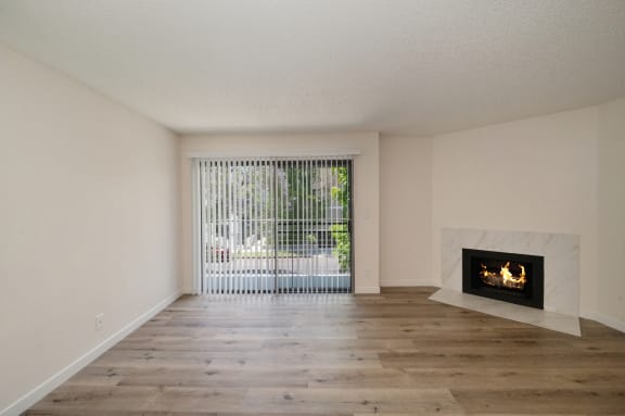 Croft Plaza 2 bedroom apartment with hardwood inspired flooring and fireplace in the living room.