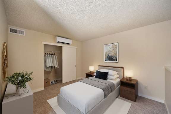 a bedroom with a bed and a closet at Fountains of Fair Oaks, Fair Oaks, CA