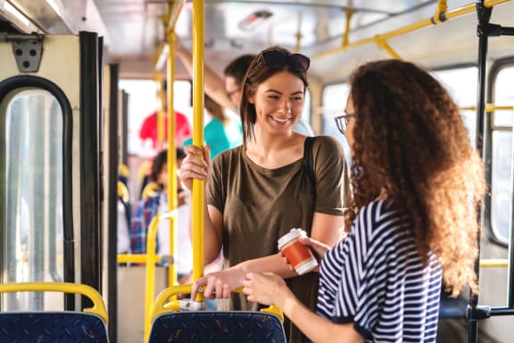 Two ladies riding on the public bus at Silverstone Apartments, Davis, California