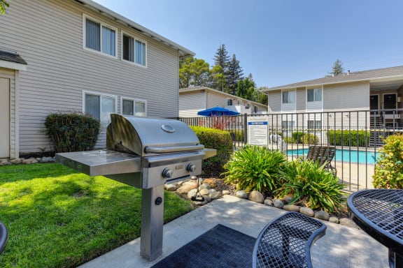 In Ground Gas BBQ available with picnic table at The Renaissance Apartments, Citrus Heights, CA