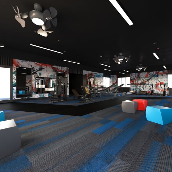 a fitness room with blue and gray carpeting and a black ceiling  at Track 281 Apartments, Sacramento, 95811