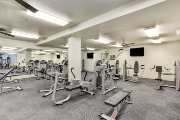 On-site fitness center with multiple weight machine systems. at The Retreat at Walnut Creek, Walnut Creek, CA, 94596