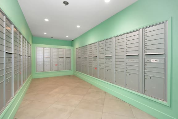 a bunch of lockers in a room with green walls  at Track 281 Apartments, Sacramento, CA, 95811