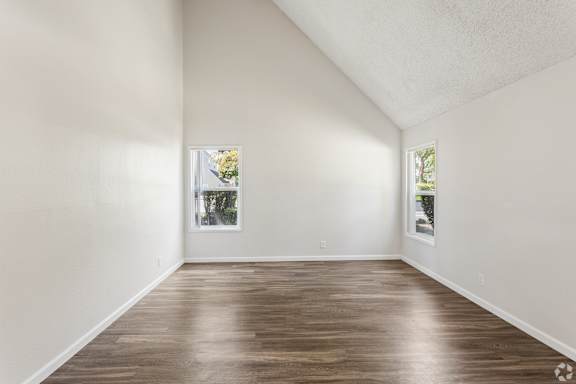 A room with wooden floors and white walls.