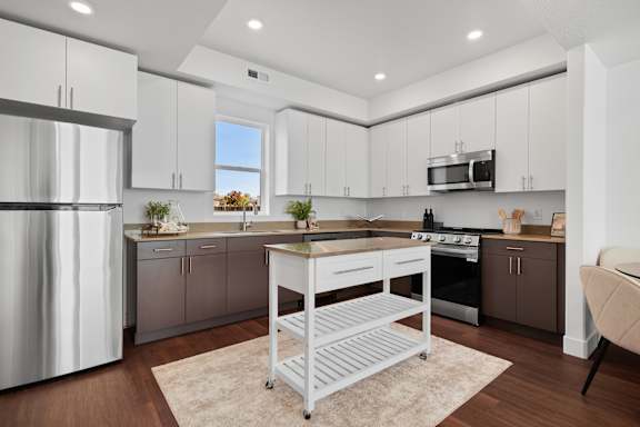 A modern kitchen with a large island in the middle.