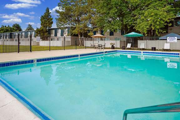A pool with a blue tiled edge and a white line down the middle.