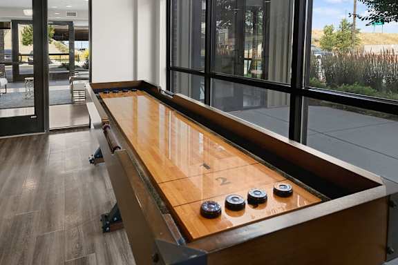 A shuffleboard table with the number 2 on it.