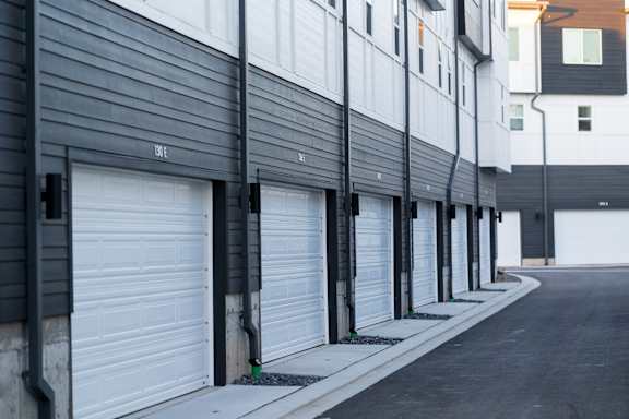 A row of garage doors are closed.