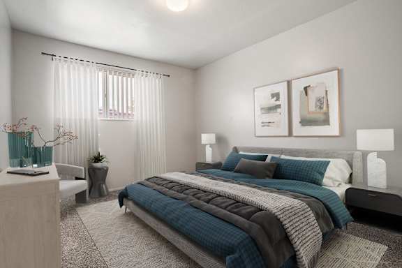 A bedroom with a large bed and a nightstand with a lamp.