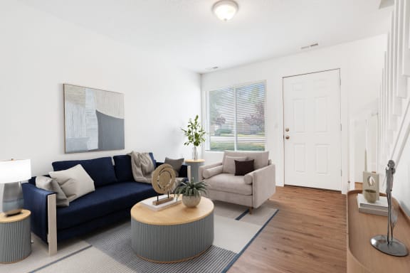 a living room with a blue couch and a coffee table