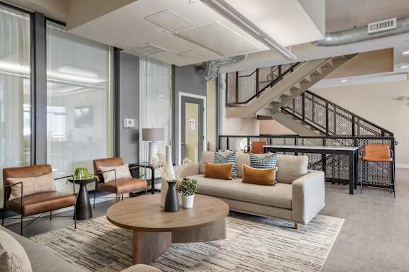 Clubhouse with a couch and a table at Sleek Lofts Denver Colorado