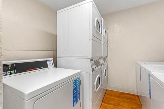 a washer and dryer in a laundry room with white appliances