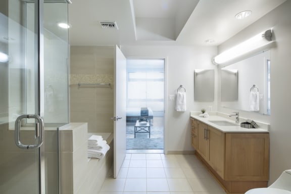 a bathroom with a glass shower stall