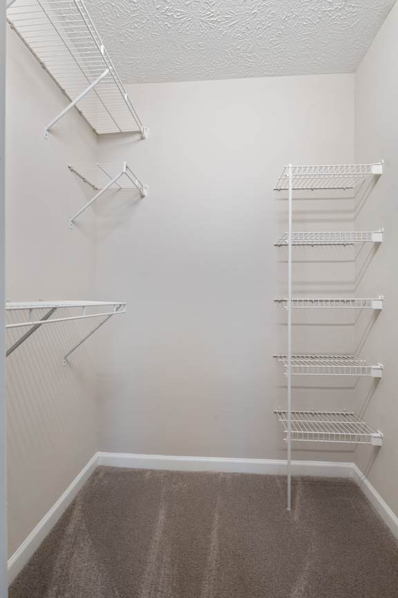 Spacious closet with white walls at Sand Creek Woods Apartments, Fishers