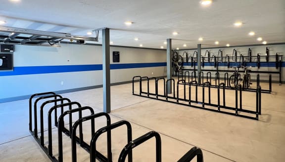 a room with a row of bikes in it