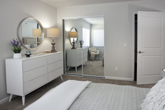 Large bedroom with mirror wardrobe doors at Club Pacifica, California, 94510