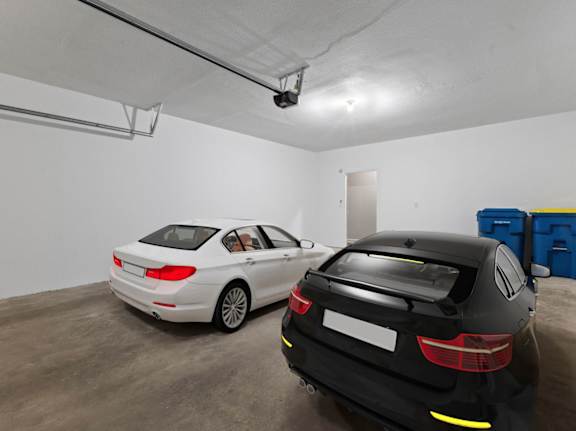 two cars parked in a parking garage