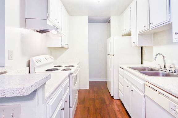 Spacious kitchens with storage space and appliances at Village Park Apartments in Encinitas, CA has spacious 1 &amp; 2 bedroom floorplans offering natural bright light,