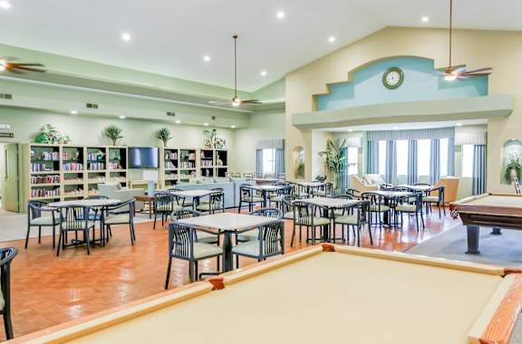 The Country Club at The Meadows community clubhouse featuring a pool table and side tables for other games and activities! Las Vegas Senior Apartments!