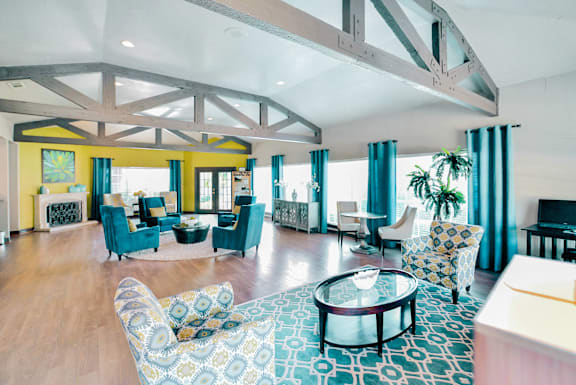 A living room with a large patterned couch and a coffee table.