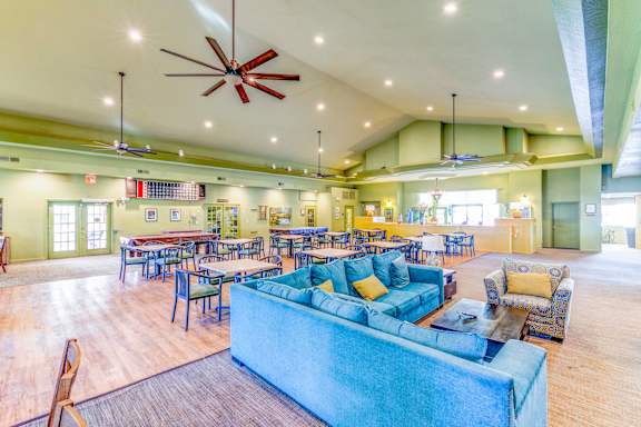 Country Club at Valley View Senior Apartments in Las Vegas offers a community clubhouse for residents to play games, read books, and play pool in!