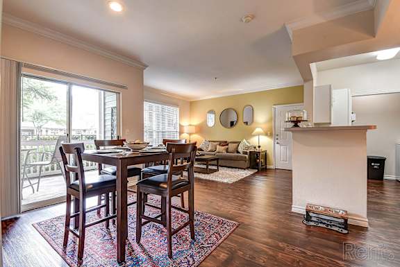 A dining room with a table and chairs at Remington at Memorial Apartments, Tulsa, OK 74133