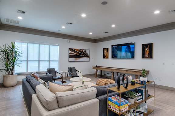 A living room with a couch, chair, and a coffee table.