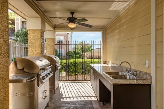 BBQ area with outdoor kitchen.
