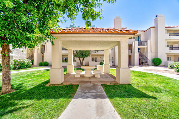 Community courtyard with beige gazebo area.